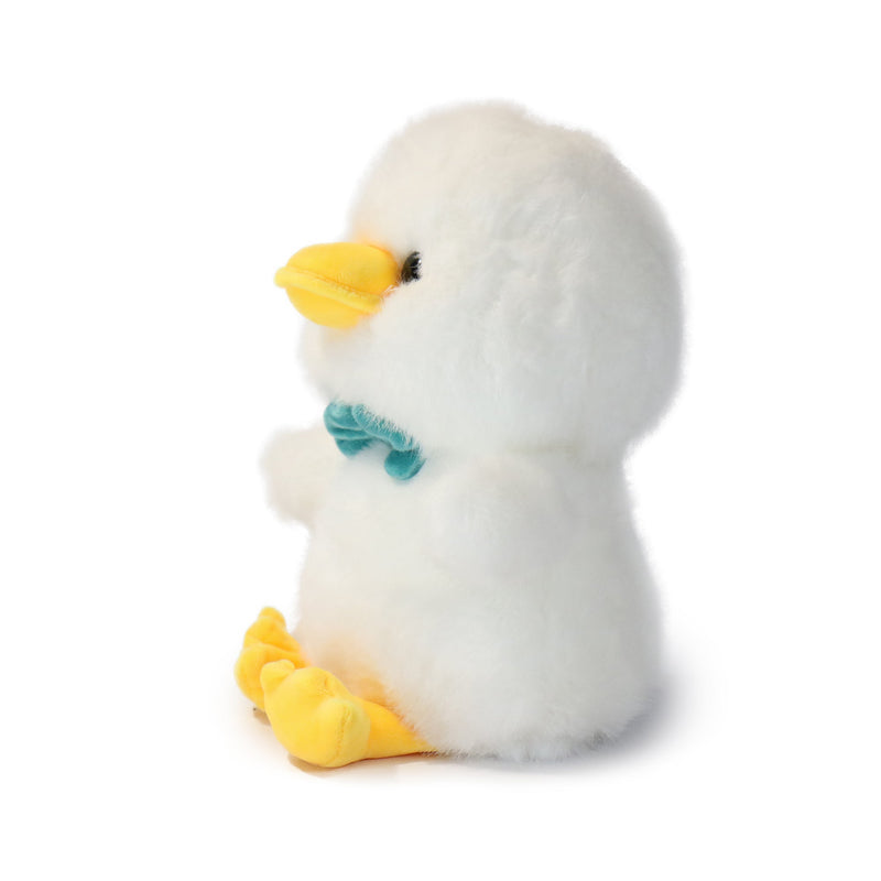 Plush toy penguin with a yellow beak and feet on a white background