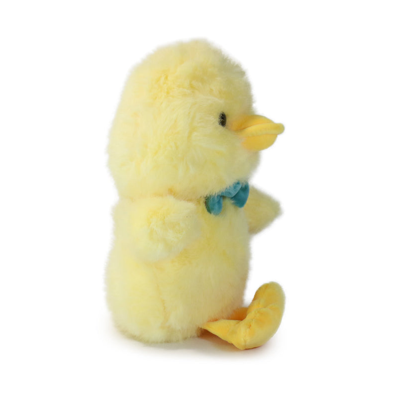Plush toy chick with a bow tie on a white background