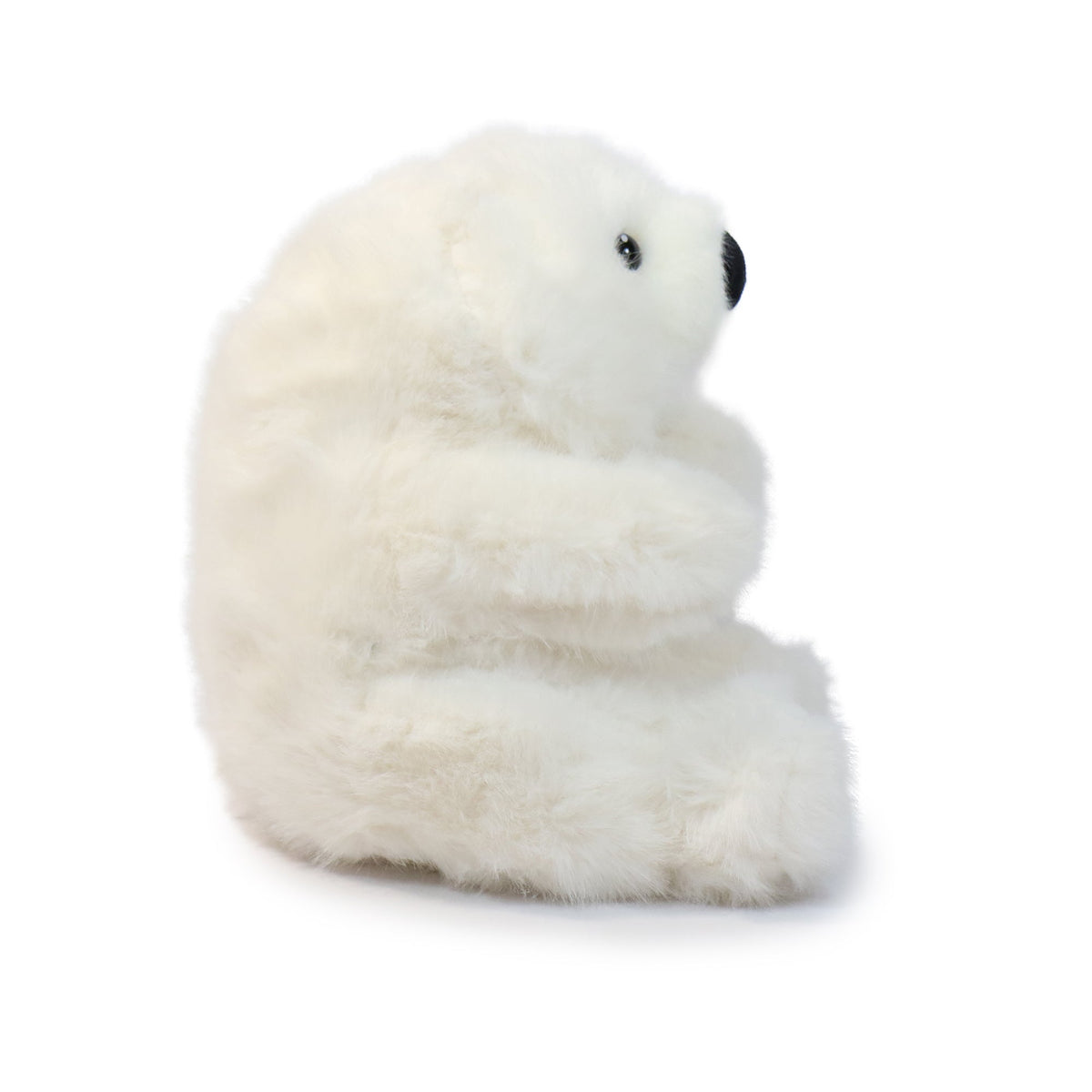 White plush polar bear toy on a white background
