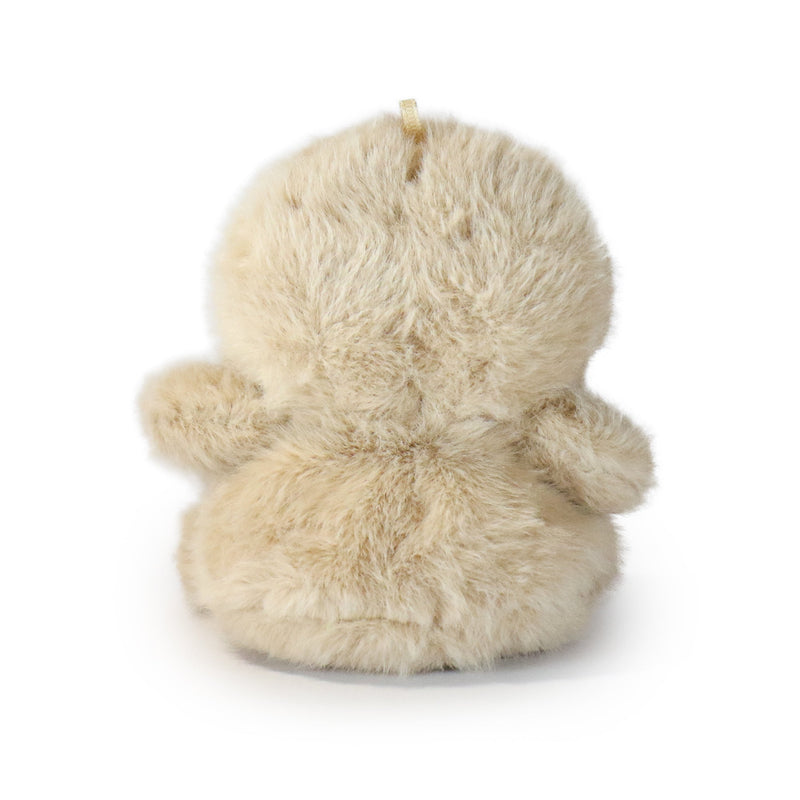 Beige plush duck toy on a white background