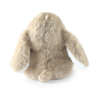 Plush toy shaped like a rabbit on a white background