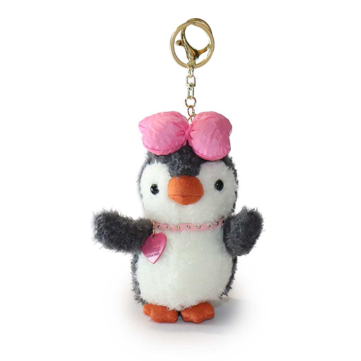 Plush penguin keychain with a pink bow and heart on a white background