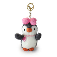 Plush penguin keychain with a pink bow and heart on a white background