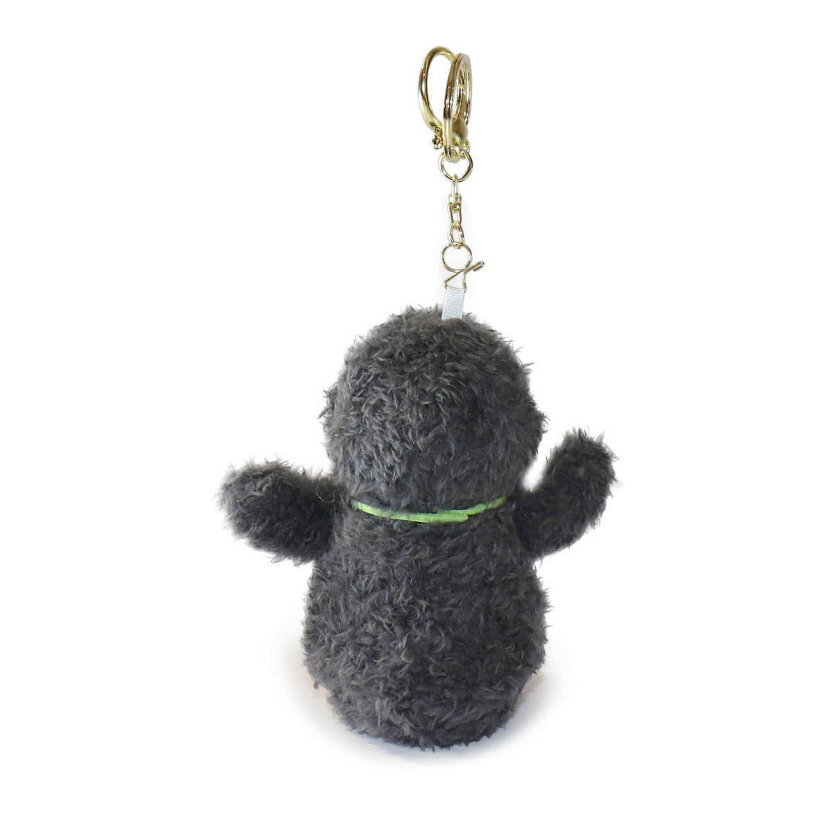 Plush keychain shaped like a dog with a green collar on a white background