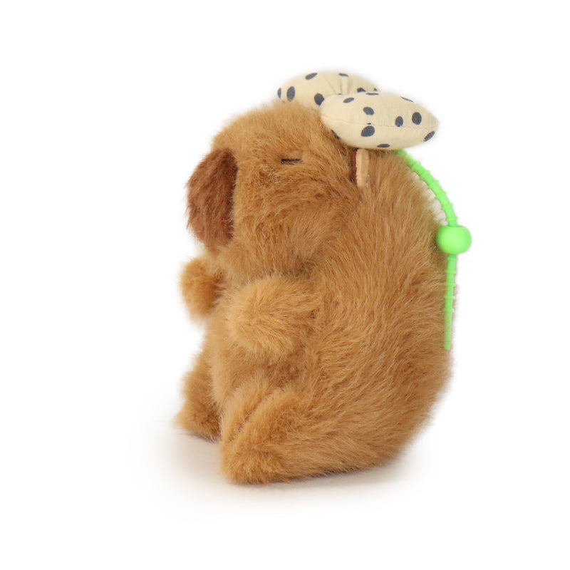 Plush dog toy with a polka dot ball on a white background
