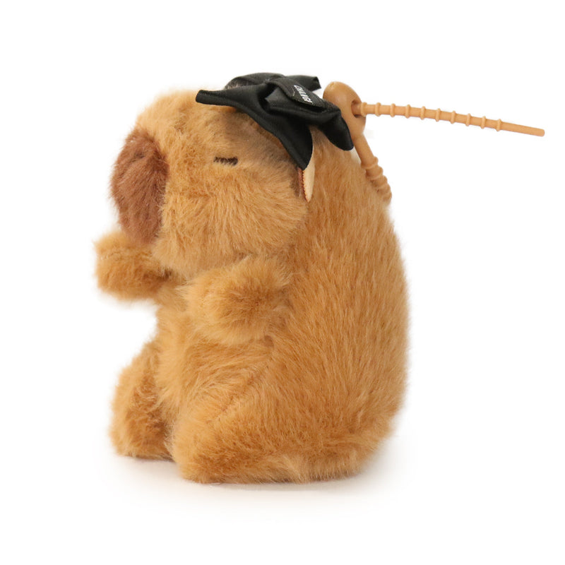 Plush dog toy with a black bow and wooden stick on a white background