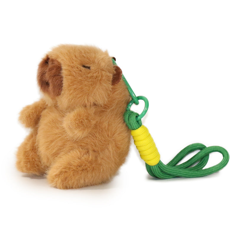 Plush bear toy with a green and yellow rope on a white background