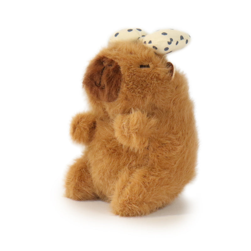 Plush bear toy with a bandaged head on a white background