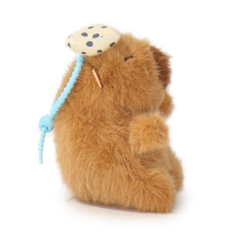 Plush toy beaver with a mushroom on a white background