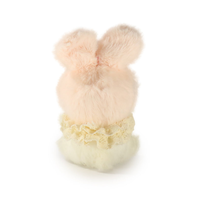 Plush bunny toy with lace trim on a white background