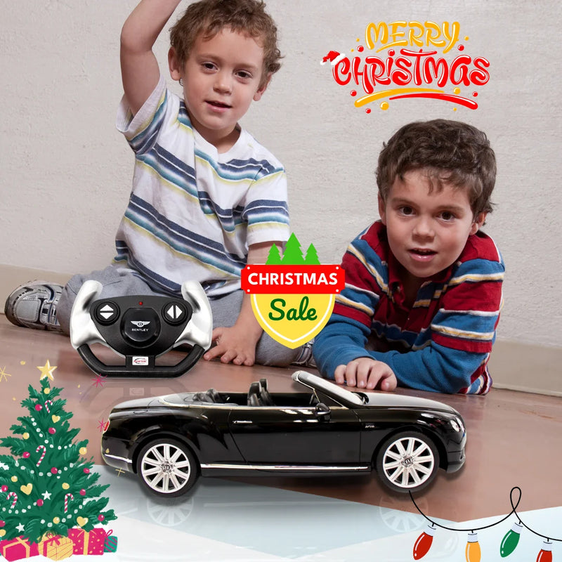 Two young boys playing with the Bentley Continental GT remote control toy car during Christmas.