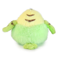 Plush toy resembling a green creature with a yellow face on a white background
