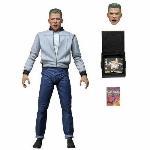 Action figure in a gray jacket and blue pants with accessories on a white background
