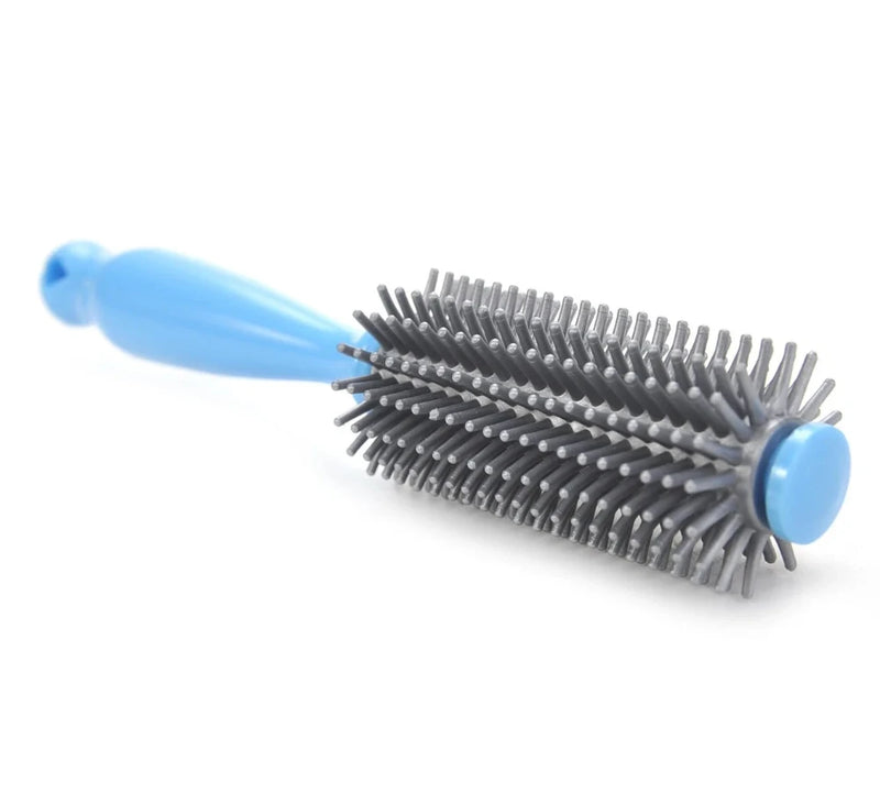 Side view of Bigboy round brush with blue handle, included in the kids' hair styling pretend playset