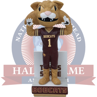 Bobcat mascot figurine with maroon and gold uniform on a white background