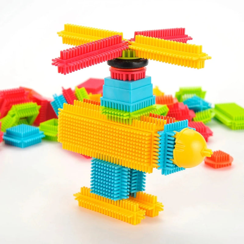 Helicopter model created with hedgehog bristle blocks, showcasing creative building possibilities for kids