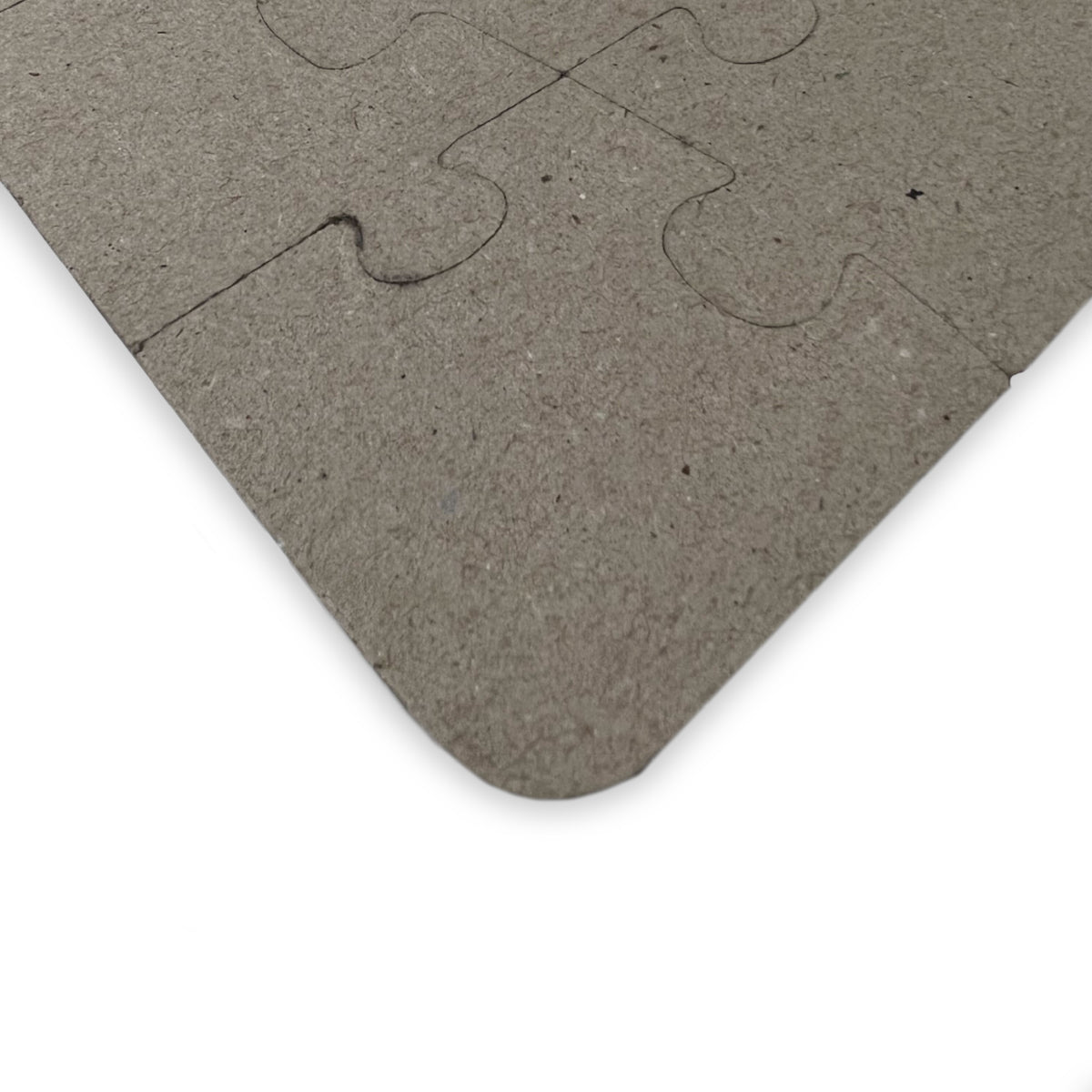 Gray puzzle piece on a white background