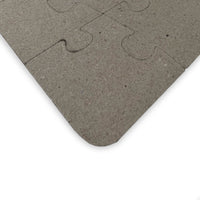 Gray puzzle piece on a white background
