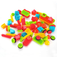 Assorted colorful pieces from the hedgehog bristle blocks toy set, including various shapes for creative construction