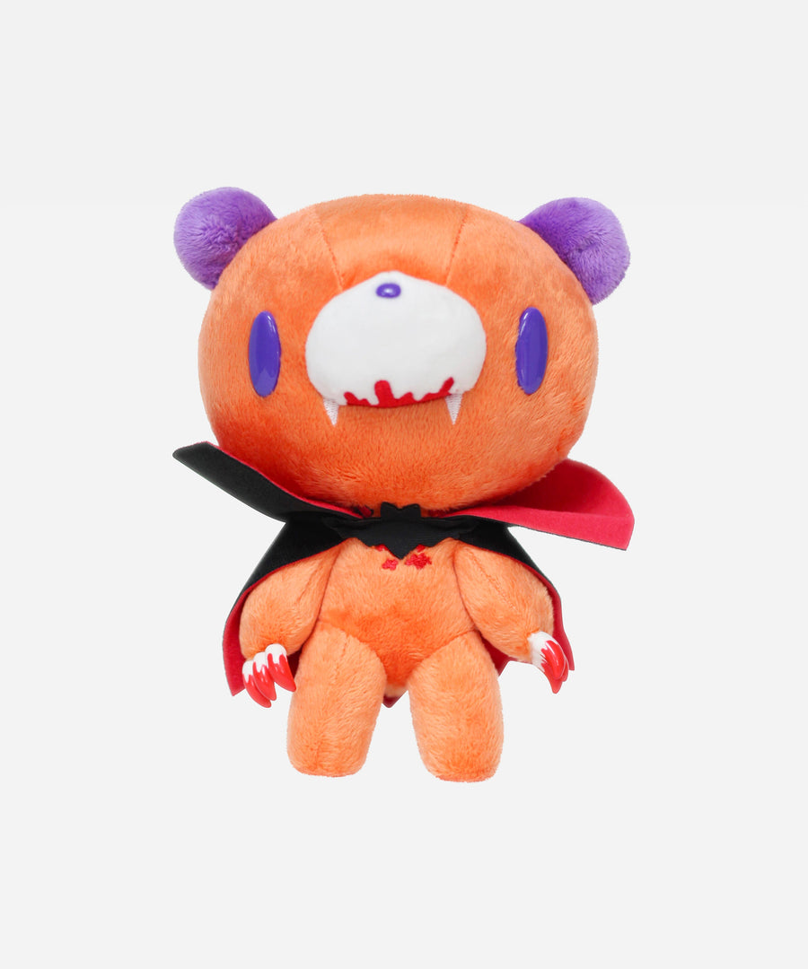 Plush toy with a vampire costume on a white background
