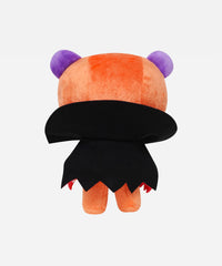 Plush toy with orange body, black skirt, and purple horns on a white background