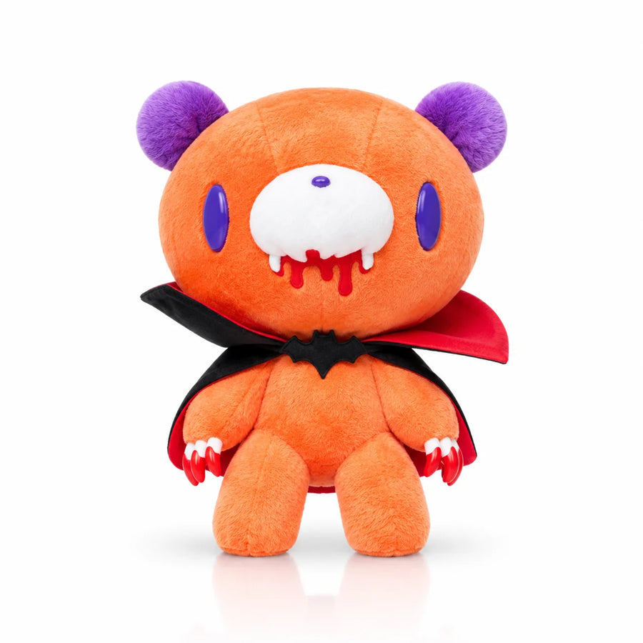 Plush toy with a vampire costume on a white background