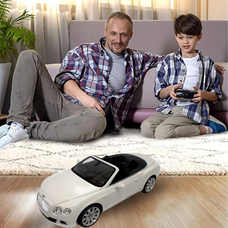 Father and son enjoying playtime with the Bentley Continental RC car in the living room.