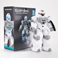 Guardian Intelligent Gesture Robot in white armor next to its black and gray box packaging, featuring a remote control and gesture sensing capabilities.