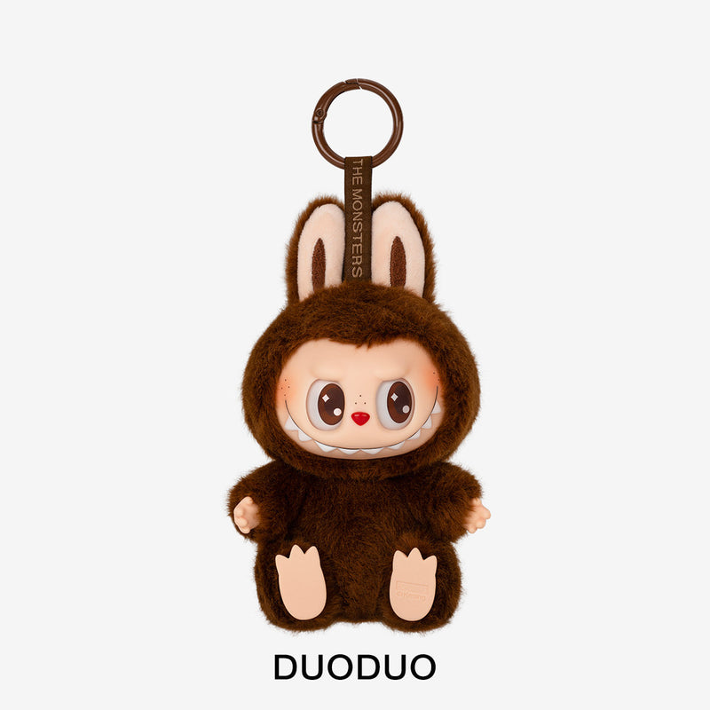 Plush keychain in a brown costume with 'DUODUO' branding on a light gray background