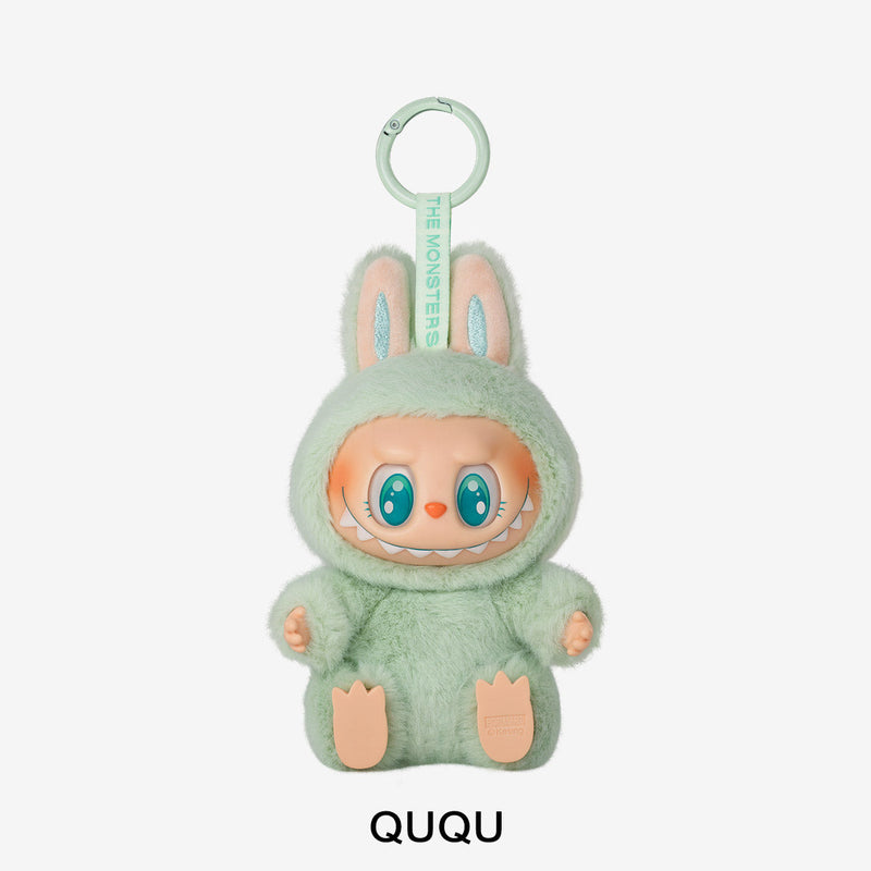 Plush toy character in a green outfit with 'QUQU' branding on a white background