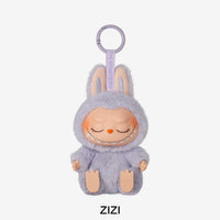 Plush toy with a purple hood and pink face on a white background, featuring the brand 'ZIZI'.