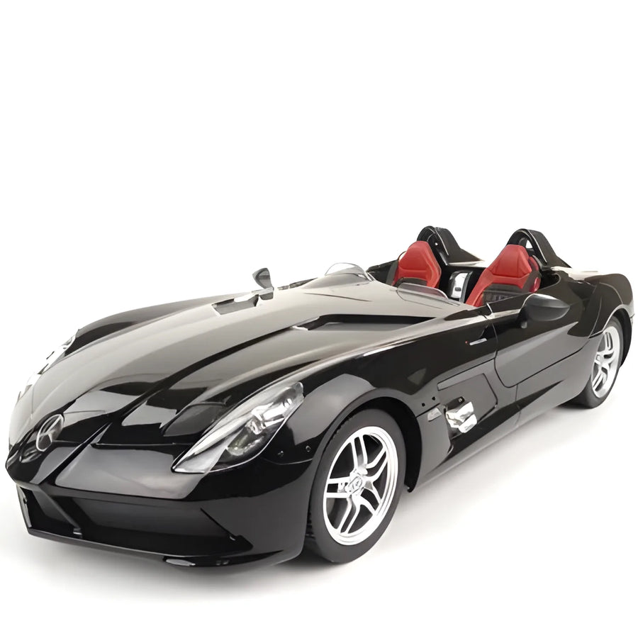 Black sports car with red interior on a white background