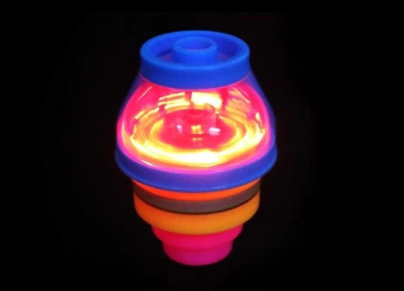 LED spinning top glowing in the dark, perfect for kids' night play with bright, mesmerizing lights.