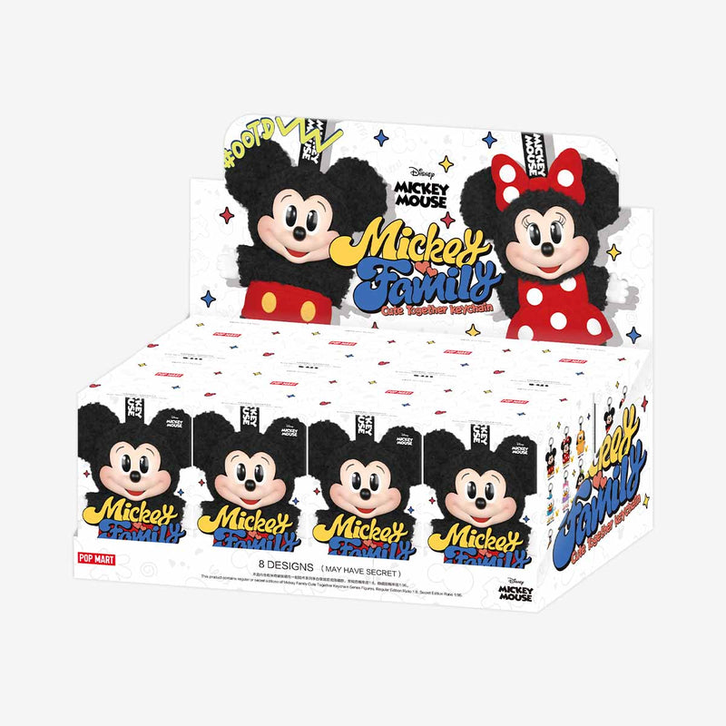 Box of Mickey Mouse figurines with cartoon characters on a white background