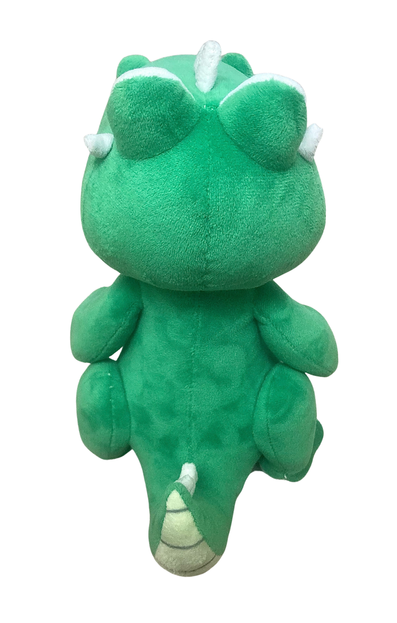 Green plush toy with white accents on a white background