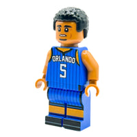 Toy figure of a basketball player in an Orlando jersey on a white background
