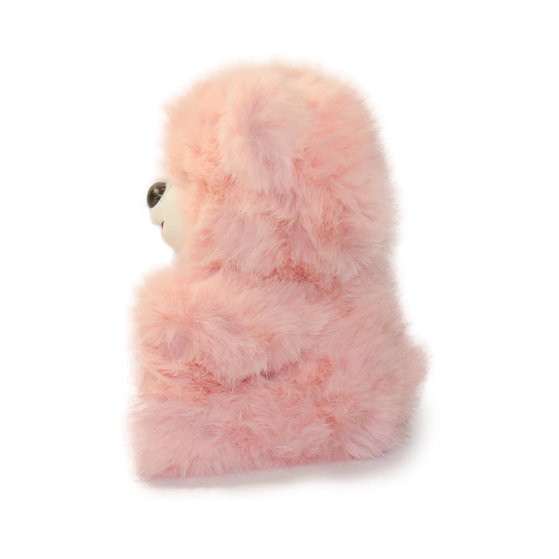 Pink fluffy toy on a white background