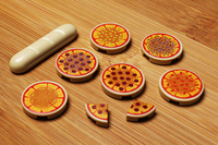 Model pizzas and bread on a wooden surface