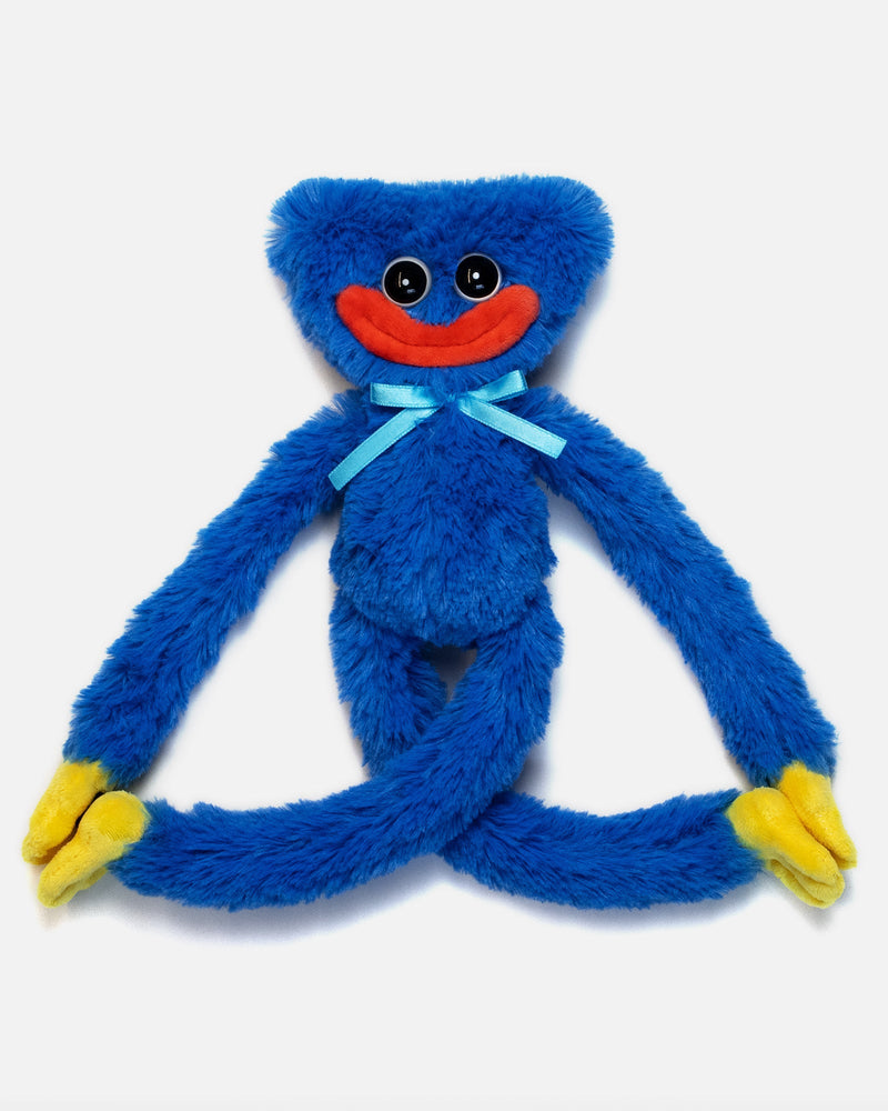 Blue plush monkey toy with a red mouth and yellow feet on a white background