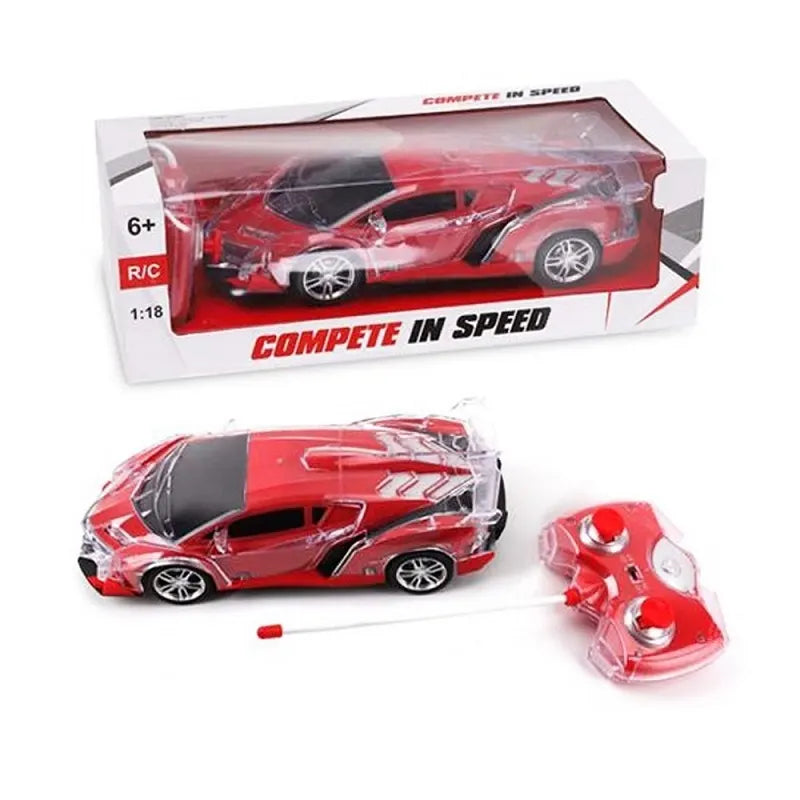 Red toy car with remote control and packaging on a white background