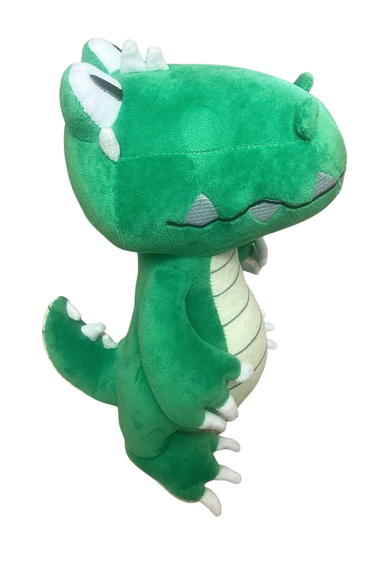 Green plush toy with white accents on a white background