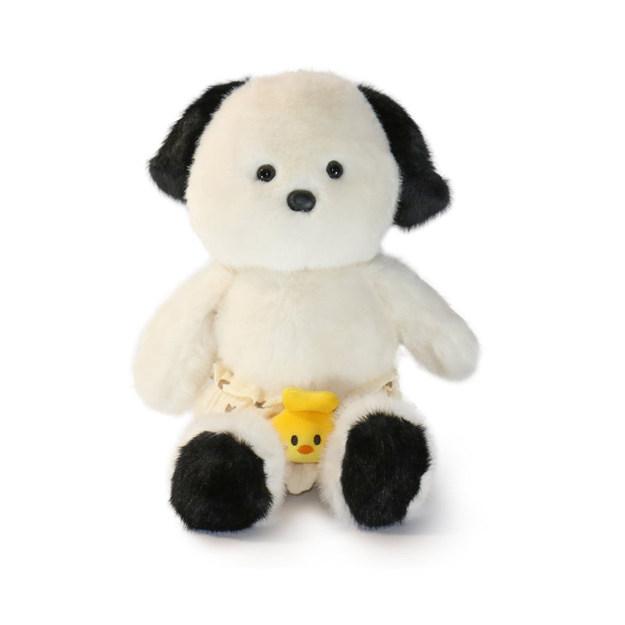 Stuffed animal toy with black and white fur and a yellow tag on a white background