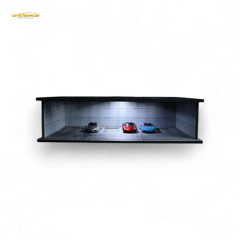Model car display case with three cars inside on a white background