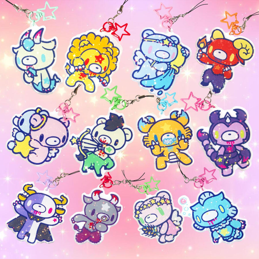 Colorful cartoon character charms on a pink background with stars