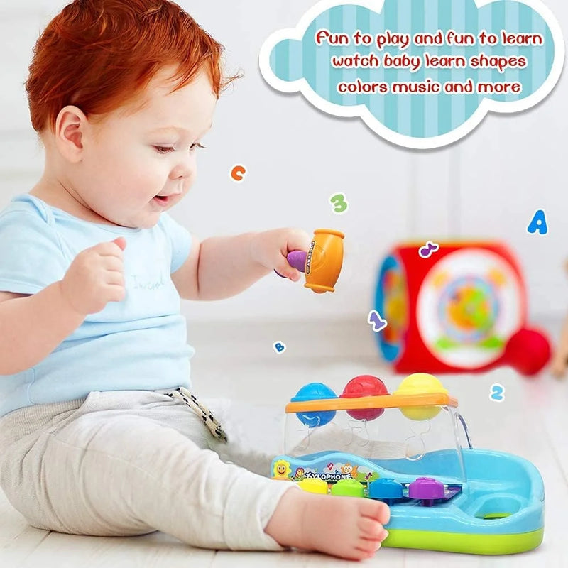 Baby playing with a xylophone piano toy, learning shapes, colors, and musical notes.
