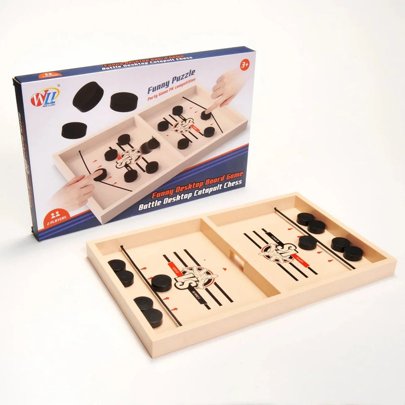 Box and game board for Battle Catapult Desktop Board Game - a fast-paced puck-shooting challenge for two players.