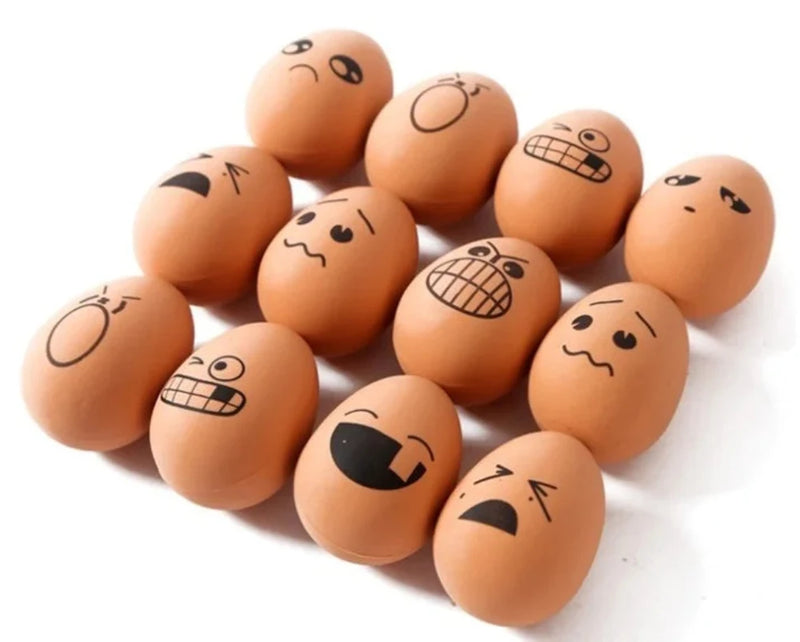Side view of bouncy egg toy set, showcasing rubber bouncy eggs with various funny faces.