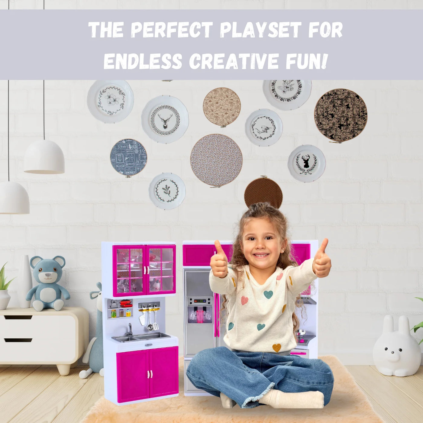 Child giving thumbs up while sitting in front of a pretend kitchen set for toddlers