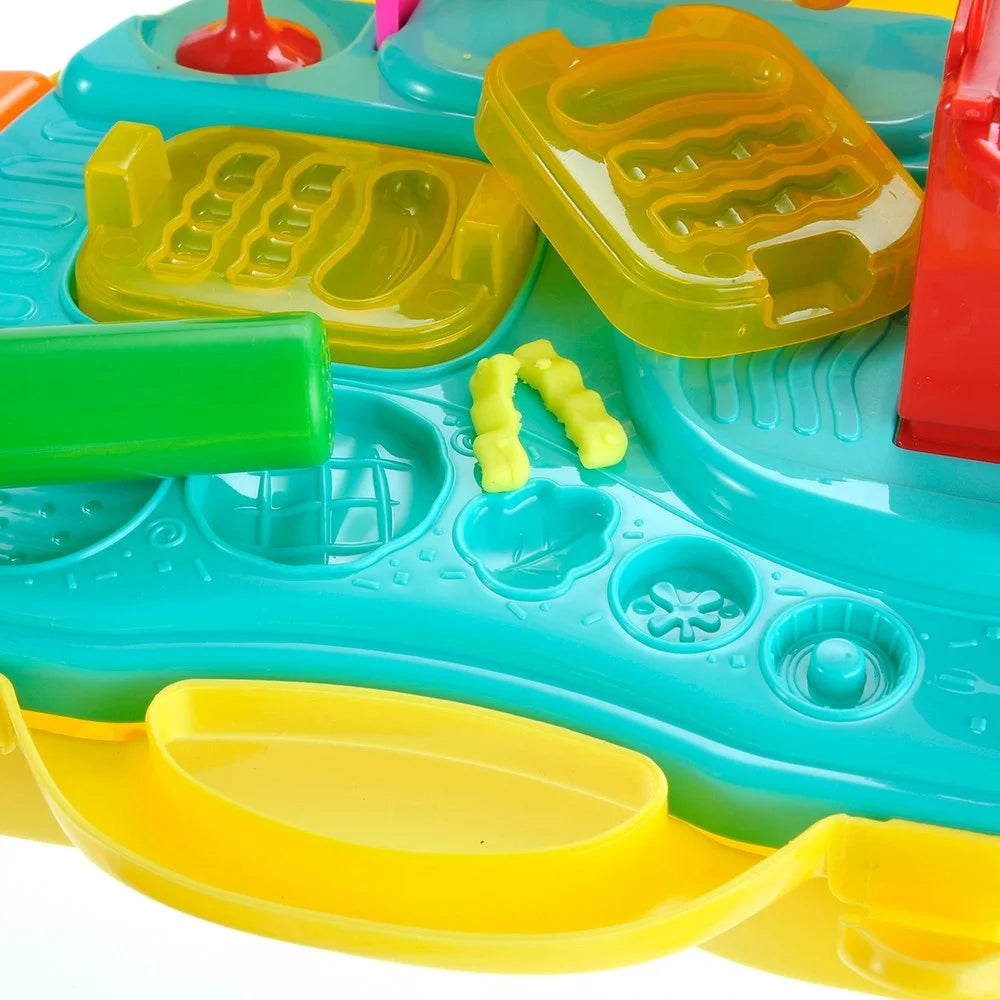 Detailed view of Cinema Snack Bar Playset with interactive molds and tools for pretend cooking