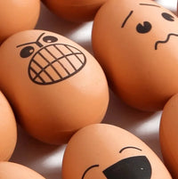 Close-up of rubber bouncy egg with an angry expression, part of the bouncy egg toy pack.